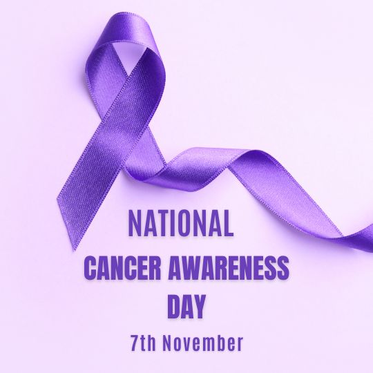a Lavender Ribbon Symbolizing Awareness is Featured with the Text 'National Cancer Awareness Day, 7th November' on a light purple background.