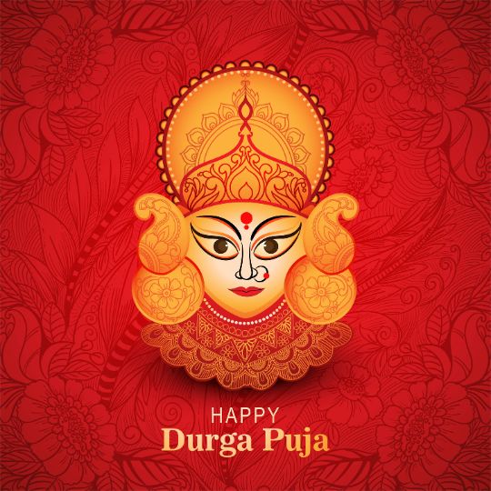 Beautiful Illustration of Goddess Durga's face on a red floral background with the text 'Happy Durga Puja' written below in golden font.