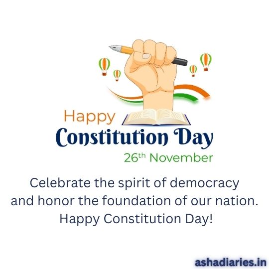 Illustration of a Raised Hand Holding a Pen Above an Open Book with Text 'Happy Constitution Day, 26th November,' featuring tricolor waves and hot air balloons in the background, celebrating the spirit of democracy.