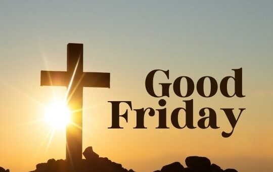 a Silhouette of a Cross Stands Atop a Rocky Hill with the Sun Rising Directly Behind It, Casting Rays of Light into the Sky. the Words "good Friday" Are Superimposed on the Image in Large, Clear Font, Suggesting the Theme of the Christian Holiday That Commemorates the Crucifixion of Jesus Christ.