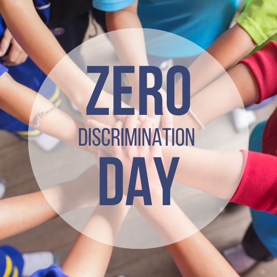 Unity in Action: Commemorating Zero Discrimination Day with a Symbolic Circle of Inclusivity | Asha Diaries the Image Depicts a Group of Individuals, Their Identities Not Visible, Joining Hands in a Circle from an Overhead Perspective. the Central Graphic, with the Text "zero Discrimination Day," Suggests a Message of Unity and the Commitment to Fight Against Discrimination in All Its Forms.