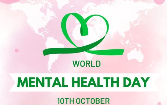 World Mental Health Day Poster Featuring a Pink and Green Theme, with a Stylized Heart-shaped Ribbon Logo over a Map of the World. the Text Reads "world Mental Health Day - 10th October."