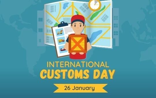 International Customs Day: Celebrating Global Trade and Regulation | Asha Diaries the Image is a Promotional Graphic for International Customs Day, Observed on January 26. It Features a Cartoon Character, Presumably a Customs Officer, Holding a Clipboard with Various Icons Related to Travel and Trade. the Character Stands in Front of a Stylized World Map and a Large Clock, Symbolizing Global Trade and Timely Operations. the Design Incorporates a Modern and Approachable Style to Raise Awareness About the Role of Customs in International Trade and Regulation.