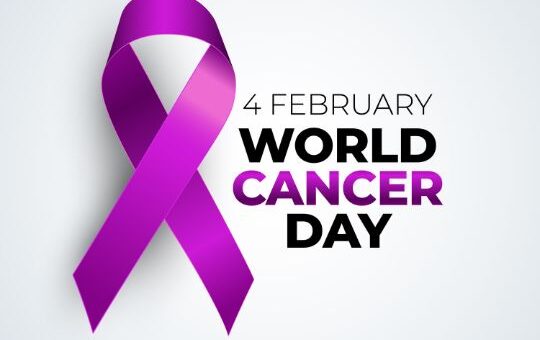 World Cancer Day Awareness Ribbon in Purple, with Text "4 February World Cancer Day" on a White Background.