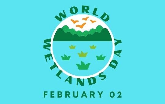 Logo for World Wetlands Day Featuring a Circular Badge Design with a Light Blue and Green Color Scheme. the Badge Depicts a Stylized Landscape of a Wetland with Green Mountains, a Blue Sky, and Flying Birds. Below the Landscape, There Are Several Green Water Plant Icons Representing Wetland Vegetation. the Text 'world Wetlands Day February 02' is Encircled Around the Badge.