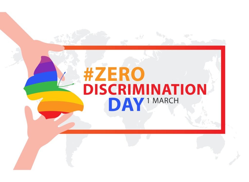 Zero Discrimination Day 1 March banner with hands holding a rainbow-colored butterfly, symbolizing equality and diversity. #ZeroDiscriminationDay.