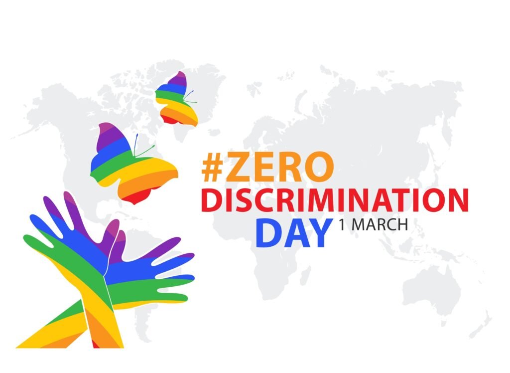 Zero Discrimination Day 1 March banner with rainbow-colored hands and butterflies, promoting diversity, inclusion, and equality.